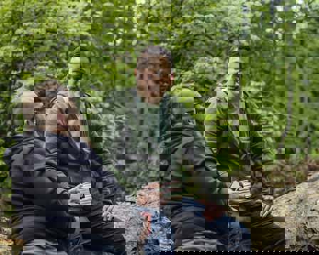 men sitting on tree talking.jpg