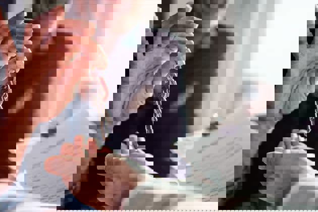 Real estate agent passing keys