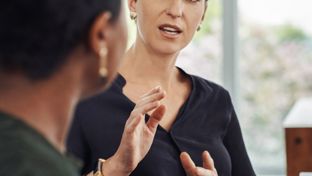 Woman explain something to someone using her hands