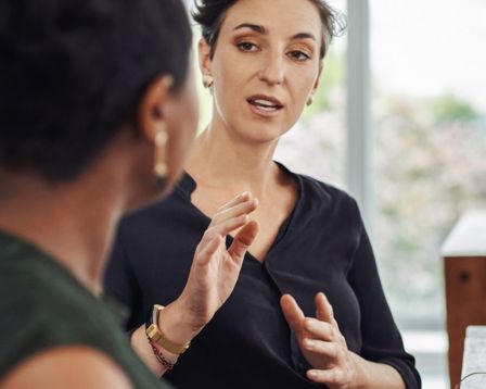 Woman explain something to someone using her hands