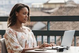 Female working on her work laptop outside.jpg