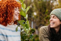 Two woman laughing in nature