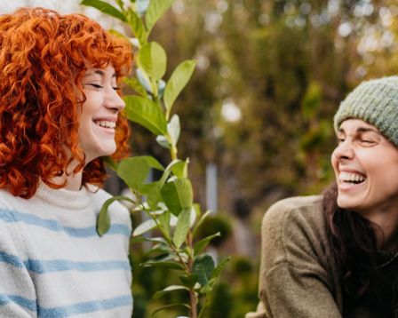 Two woman laughing in nature