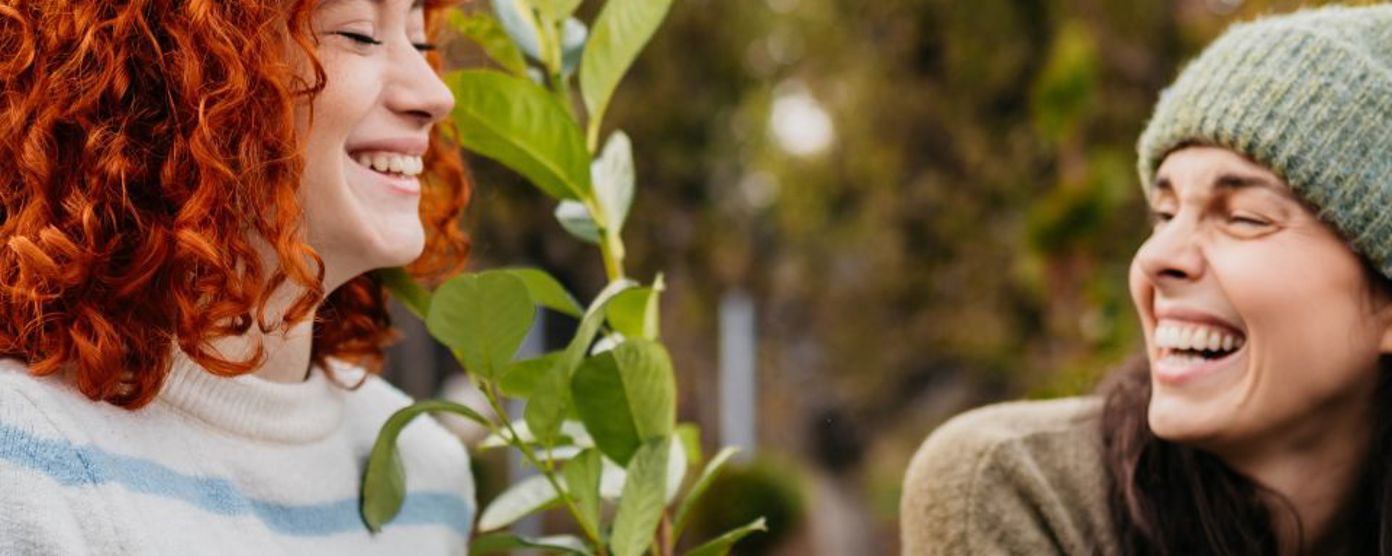 Two woman laughing in nature