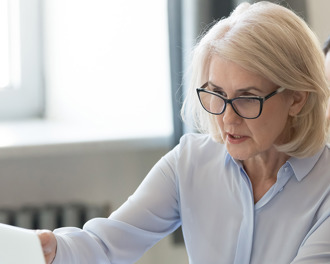 older-and-young-women-looking-at-a-laptop-screen.jpg