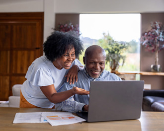 senior-couple-paying-bills-using-their-laptop.jpg